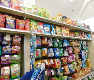 Shelves of packages of candies, taken in  a London Drugs store. 