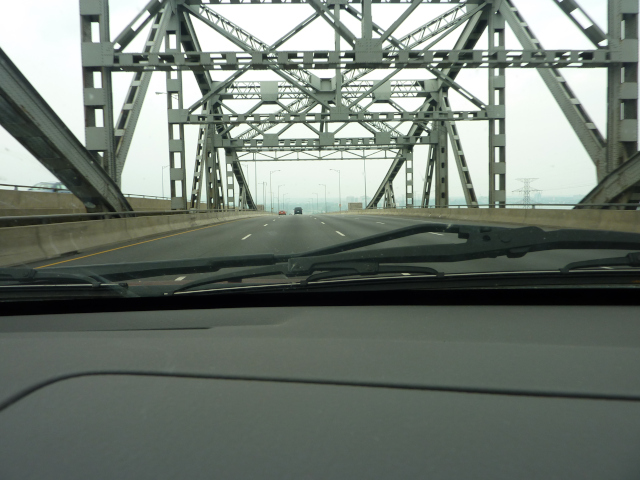 photo of bridge taken from within a car traveling on it.
