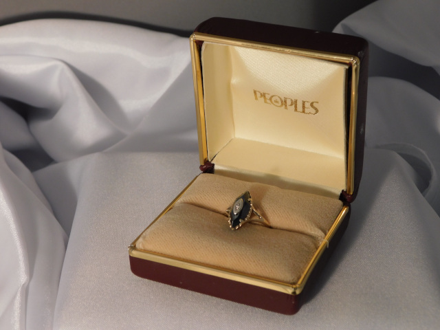 Photo of a ring box with my black diamond ring.  